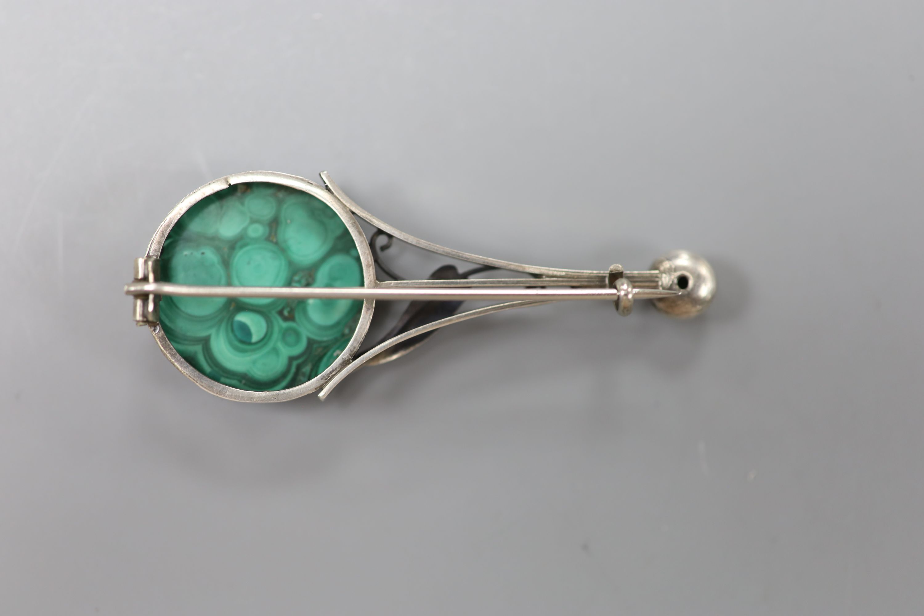 A stylish 20th century white metal, malachite and split pearl set brooch, 6cm, gross 11.8 grams.